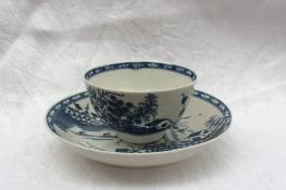 An 18th century Worcester blue and white tea bowl and saucer painted in The Rock Strata Island