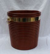 A modern mahogany peat bucket in the George III style with a ribbed body brass bandings and brass
