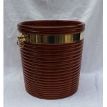 A modern mahogany peat bucket in the George III style with a ribbed body brass bandings and brass