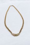 A 9ct yellow gold belcher chain with a crescent pendant set with diamonds, approximately 11.
