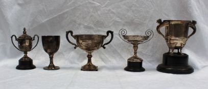A George V silver twin handled trophy cup with dragon handles on four paw feet, London, 1929,