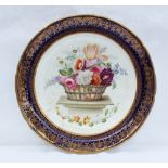 A 19th century porcelain plate painted to the centre with a basket of flowers on a plinth produced