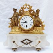 A 19th century gilt spelter and alabaster mantle clock, with a central floral and grape hung swag