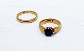 A 22ct yellow gold sapphire set signet ring, together with a 22ct yellow gold wedding band,