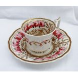 A Coalport porcelain cup and saucer, painted with bands of pink roses to a floral gilt border