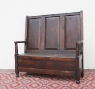 An 18th century style oak bench,