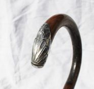 A George V silver capped walking cane with an anthemion embossed silver tip, Birmingham,