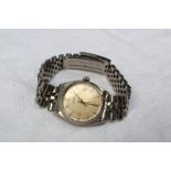 A Gentleman's Rolex oyster perpetual wristwatch, the silvered dial with gilt batons, gilt metal