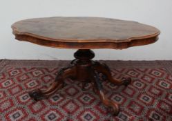 A Victorian walnut supper table,