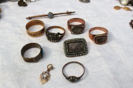 A collection of mourning jewellery including a 19th century 18ct yellow gold band,