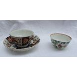 An 18th century Worcester tea bowl and saucer decorated in the radiating Imari palette, seal mark to