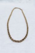 A 9ct yellow gold belcher chain with circular interlocking links, approximately 33.