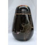 A Dennis China Works pottery trial vase and cover decorated in the Fulani head pattern, impressed