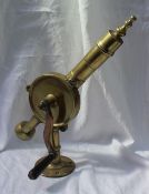 A brass counter top cork screw "The patent Eclipse", with a wooden handle,