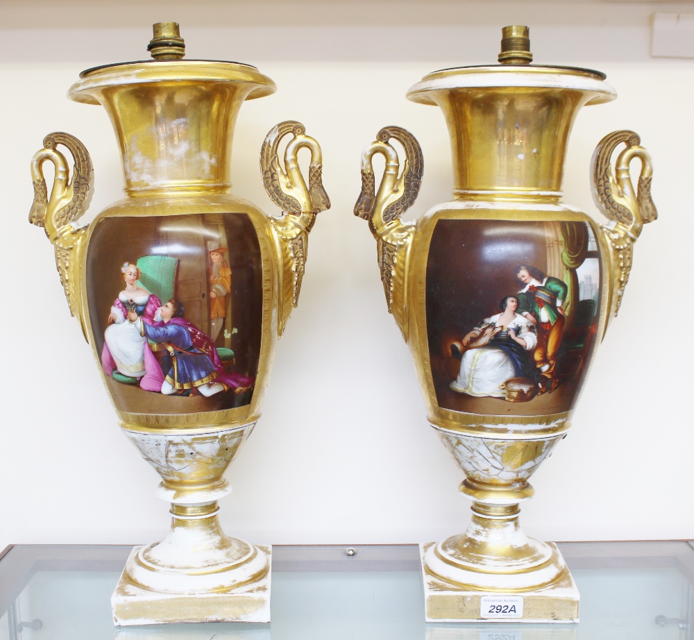 A pair of Paris porcelain twin swan neck handled vases painted to one side with landscape scenes