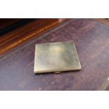 A 9ct yellow gold cigarette case with engine turned decoration,