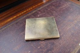 A 9ct yellow gold cigarette case with engine turned decoration,