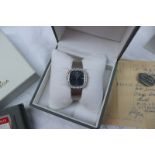 An 18ct white gold diamond set Omega De Ville lady's wristwatch, with a blue line decorated dial,