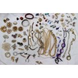 Assorted costume jewellery including a silver hinged bangle, brooches, earrings, watches, necklaces,