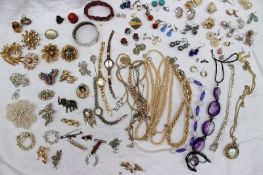 Assorted costume jewellery including a silver hinged bangle, brooches, earrings, watches, necklaces,