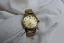A Gentleman's 9ct yellow gold Garrard wristwatch, with a silvered dial,