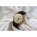 A Gentleman's 9ct yellow gold Longines wristwatch, the silvered dial with Arabic numerals and a