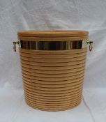 A modern maple peat bucket in the George III style with a ribbed body brass bandings and brass drop