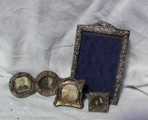 A late Victorian silver photograph frame, embossed with flower heads and scrolls, Birmingham, 1900,