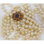 A long double string of pearls with 198 individually knotted regular spherical pearls each