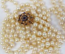 A long double string of pearls with 198 individually knotted regular spherical pearls each