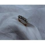 A five stone diamond ring set with old cut diamonds totalling approximately 1 carat,