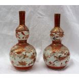 A pair of 19th century Japanese porcelain Kutani double gourd vases decorated with birds, flowers