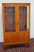 A 20th century satin walnut Biedermeier style display cabinet,