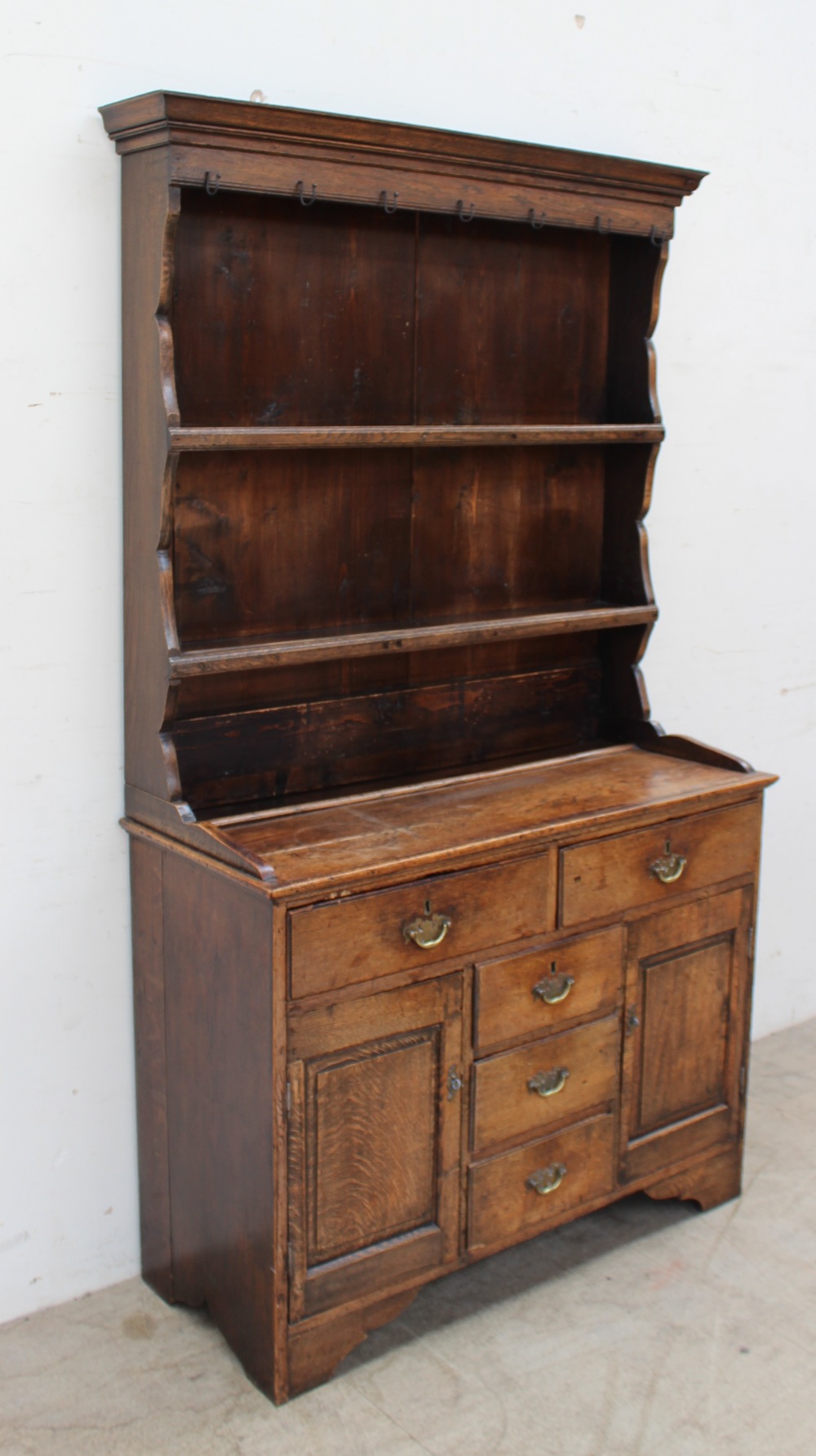 A late 19th / early 20th century oak North Wales type dresser the rack with a moulded cornice above - Image 2 of 4