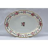 A Nantgarw porcelain oval dish painted with a single rose to the centre, garlands of roses in the