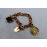 A 9ct gold bracelet set with a 15ct gold medallion, and a fob seal,