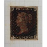 A stamp album containing British stamps including a Penny Black, Penny Reds,