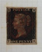 A stamp album containing British stamps including a Penny Black, Penny Reds,