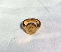 An 18ct yellow gold signet ring with lions head erased seal, approximately 13.4 grams CONDITION