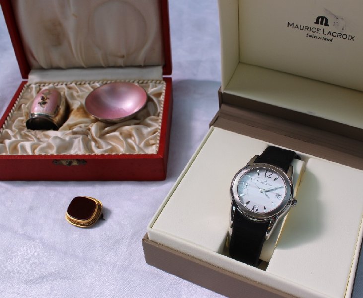 A Maurice Lacroix stainless steel lady's wristwatch the white dial with Arabic numerals and batons