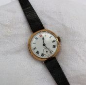 A 9ct yellow gold mid size wristwatch, the enamel dial with Roman numerals and a seconds