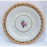 A Derby porcelain cabinet plate, with a shaped gilt rim to a peach border, painted to the centre