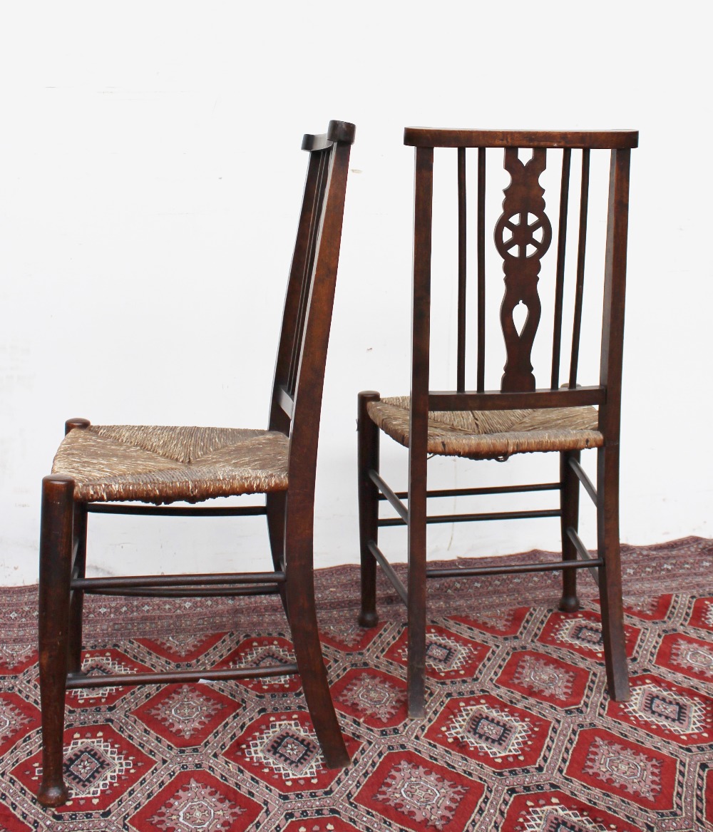 A pair of 19th century beech bedroom chairs with wheelback splats and rush seats on tapering legs, - Image 2 of 2