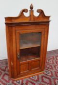 A 19th century oak hanging corner cupboard,