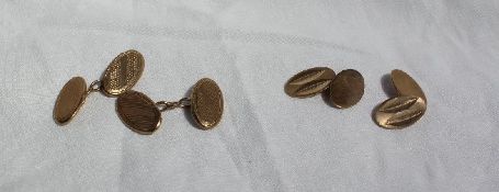 A pair of 9ct yellow gold cuff links of oval form,