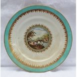 A Derby porcelain cabinet plate, painted with a bridge across a river in a turquoise and gilt