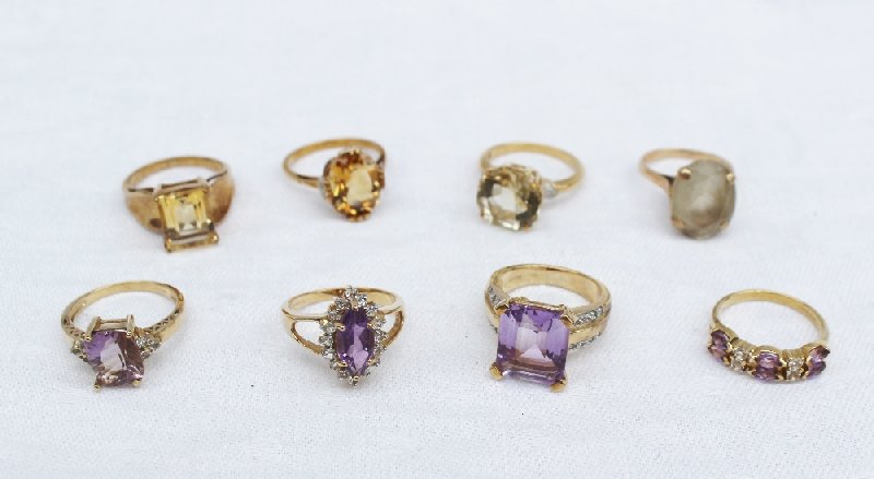A 9ct yellow gold amethyst and topaz dress ring together with a citrine dress ring,