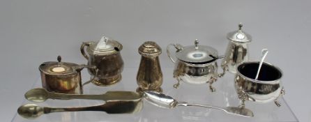 A George VI silver three piece cruet set comprising a mustard pot and cover, pepperette and open