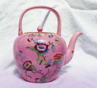 A Victorian Beech Hancock & Co teapot with a looped handle over the circular finial topped cover and
