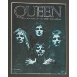 Queen - a signed copy of  "A visual documentary by Ken Dean" signed by Freddie Mercury,